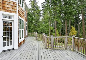 Wooden deck on house near forest